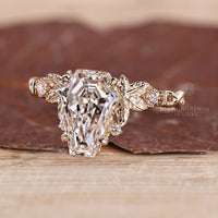 Diamondrensu coffin ring with lab grown diamond center stone.