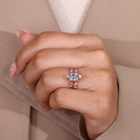 Marquise engagement ring with tulip setting and six prong design.