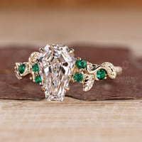 Diamondrensu coffin ring with lab grown diamond center stone.