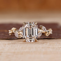 Nature inspired engagement ring with emerald old european cut diamond center.