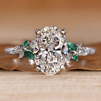 Oval engagement ring with round and marquise side stones.