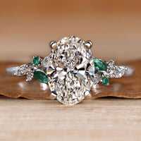 Oval engagement ring with round and marquise side stones.