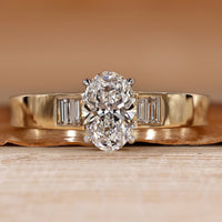 Oval cut diamond ring with baguette side stones.