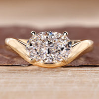 Oval cut diamond ring with east to west setting and solitaire style.