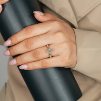 Oval diamond ring with hidden halo and round diamond.