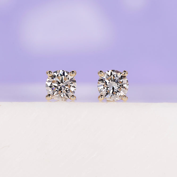 Elegant yellow gold diamond earrings for timeless style.