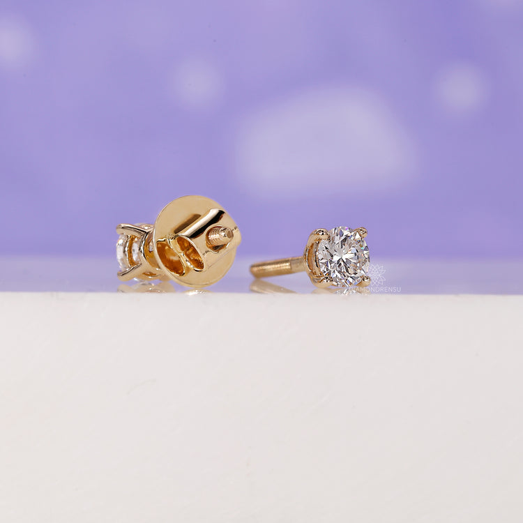 Simple diamond earrings studs with a modern touch.