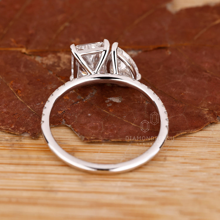 Handmade ring featuring pear and radiant diamonds, crafted for a one-of-a-kind design.