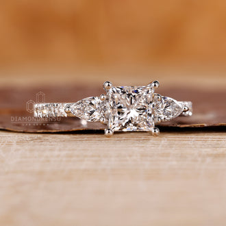 White gold ring paired with princess cut diamond ring in handmade ring design.