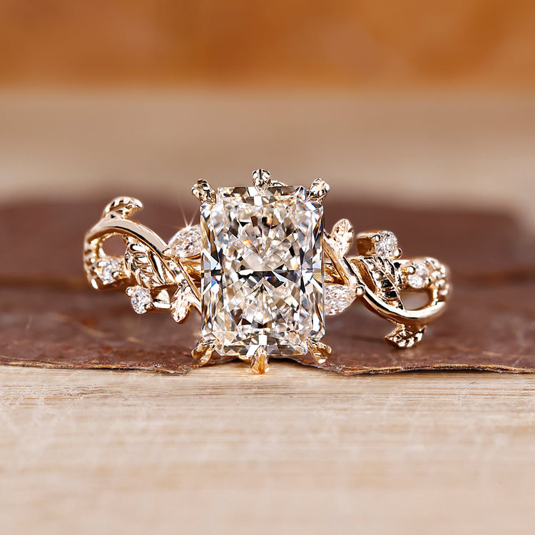 Radiant cut diamond ring with six leaf style prong in yellow gold