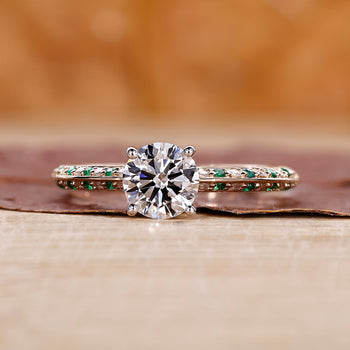 Two Tone Diamond Ring featuring a round cut diamond in a four prong ring setting.