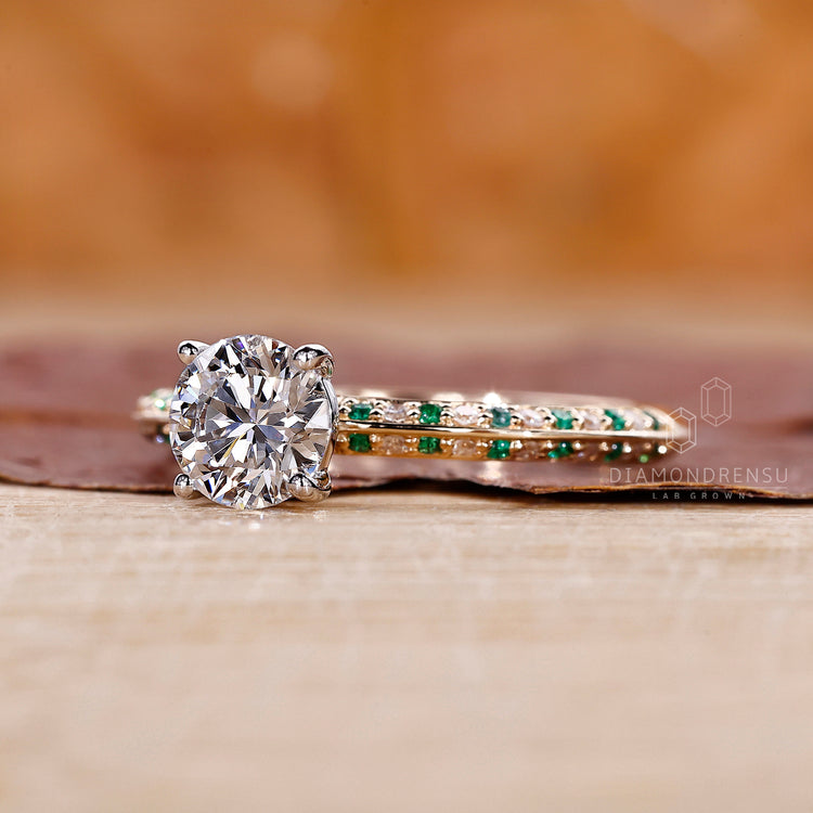 Green Diamond Ring with a round cut diamond in a four prong setting for secure hold.