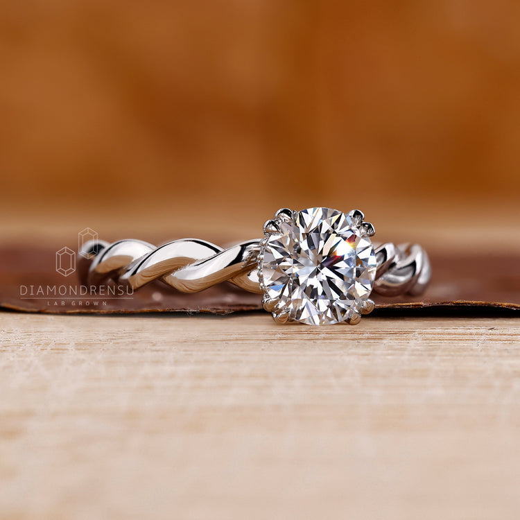 Handmade ring featuring round diamond and hidden halo