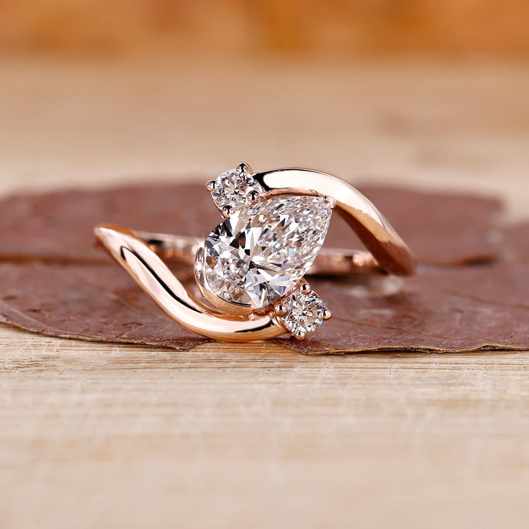 Pear diamond engagement ring in rose gold.