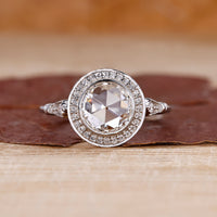 Round rose cut engagement ring with lab grown center diamond.