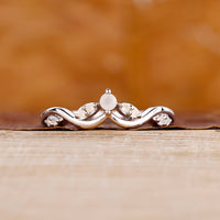 Moonstone wedding band with round cut moonstones.