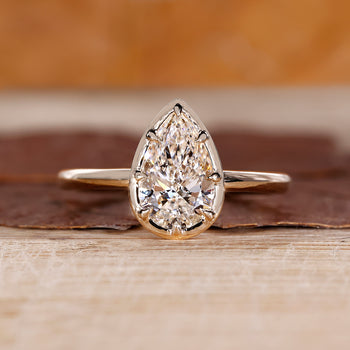 Pear cut diamond engagement ring with solitaire setting handmade.