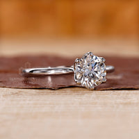 A solitaire diamond ring shines with brilliance.