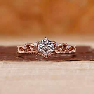 Round cut diamond engagement ring with rose gold band.