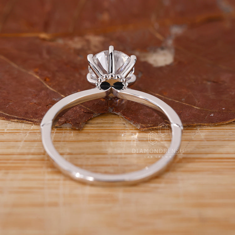 Hidden milgrain setting adds subtle texture beneath the stone, perfect for those seeking something classic yet different.