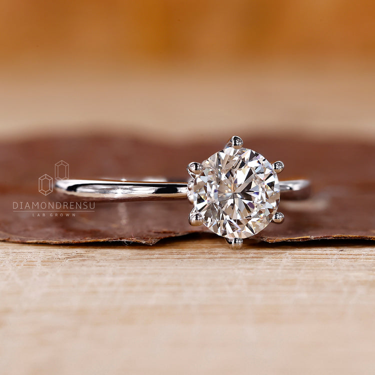 Solitaire engagement ring handcrafted with attention to detail, featuring IGI certified stones for added reliability.
