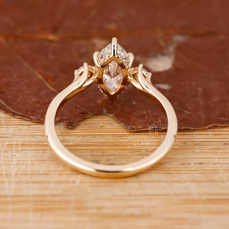 Six prong ring with a marquise diamond, providing a secure and stable setting while highlighting the centre stone.
