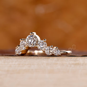 Shared prong wedding band with sparkling round cut diamonds.