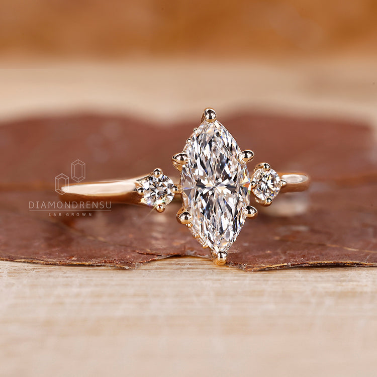 Marquise and 2 round side diamond ring featuring clean lines and a sleek, secure prong setting for everyday wear.