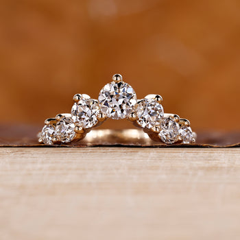 U shaped wedding band featuring seven lab grown diamonds.