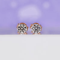 1 carat diamond stud earrings with an elegant diamond prong setting.