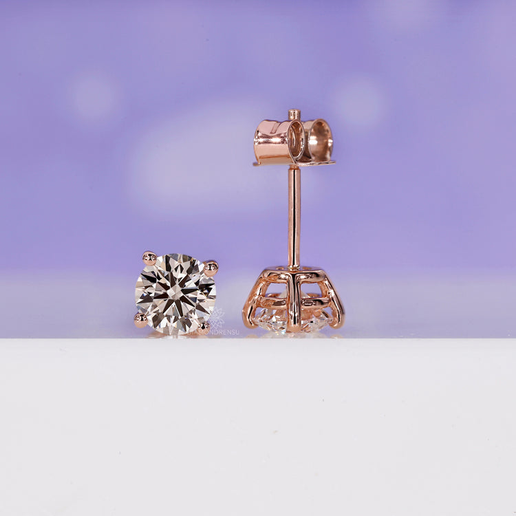 Stunning round earrings studs in a sophisticated rose gold finish.