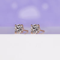 Round diamond stud earrings featuring a secure 4 prong setting.