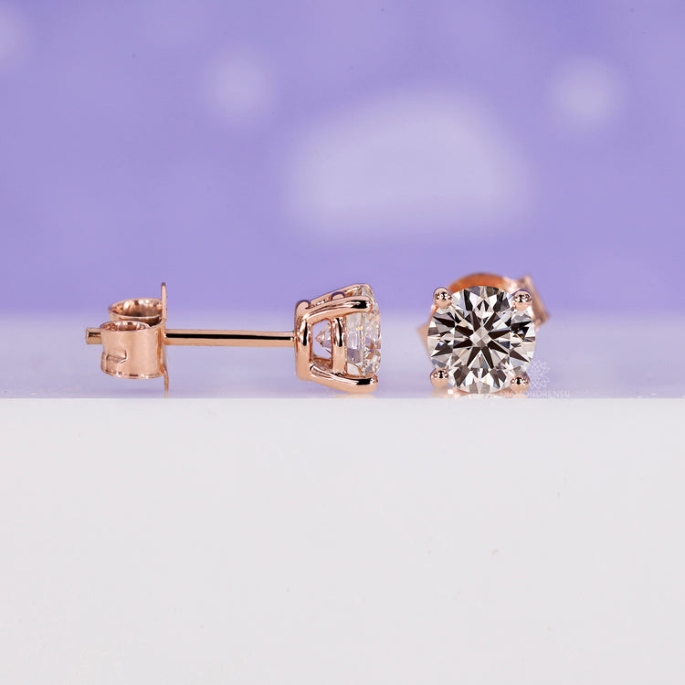 Round stud diamond earrings crafted with precision for a classic look.