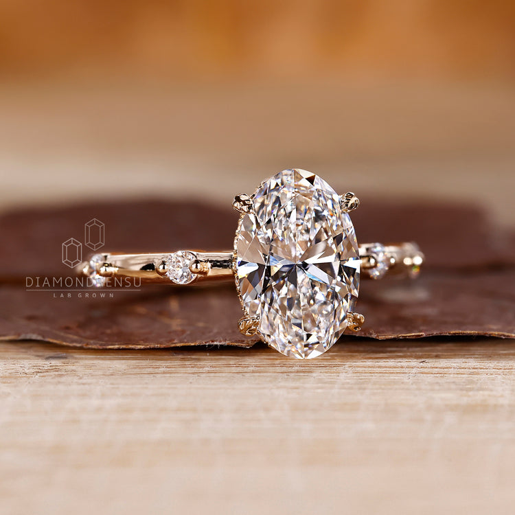 Oval Diamond ring in leaf style prong setting