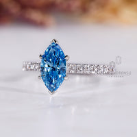 Blue marquise diamond ring in white gold with v shaped prong.