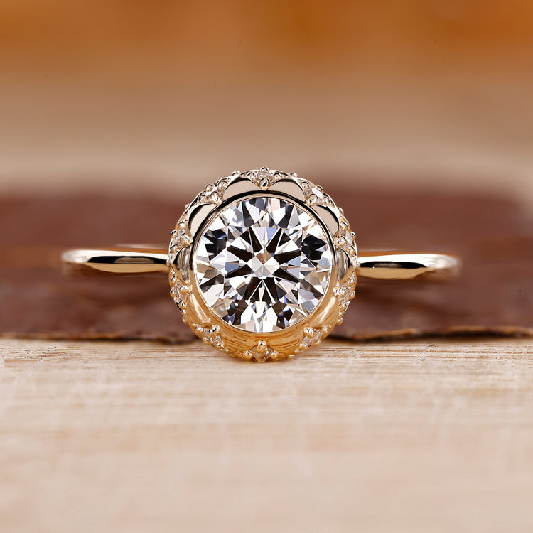 Vintage Diamond Ring with a round cut diamond, set in a yellow gold band.