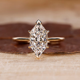 Cathedral Setting Ring with Dutch marquise diamond in yellow gold.