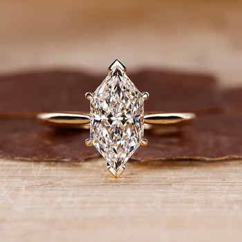 Cathedral Setting Ring with Dutch marquise diamond in yellow gold.