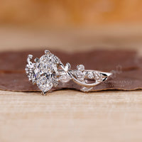 6 claw prong securely holds the oval center diamond.