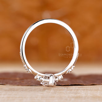 White gold diamond ring featuring milgrain detail and handmade design.