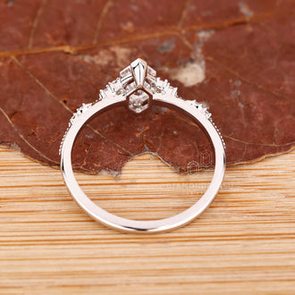 Custom engagement ring Dutch marquise diamond with round cut accents.