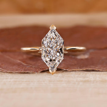 Dutch Marquise Engagement Ring with a round diamond and cathedral setting in yellow gold.
