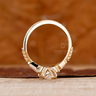 IGI certified handmade ring featuring marquise diamond and kite side diamonds.