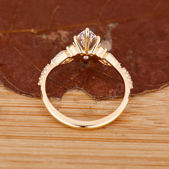 Buy engagement ring with marquise diamond and tapered shank yellow gold.