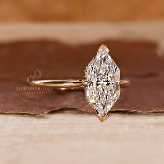 V Prong Ring with a round diamond and yellow gold band in a custom design.
