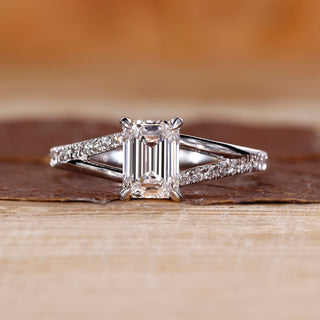 Emerald shape engagement ring with split shank.