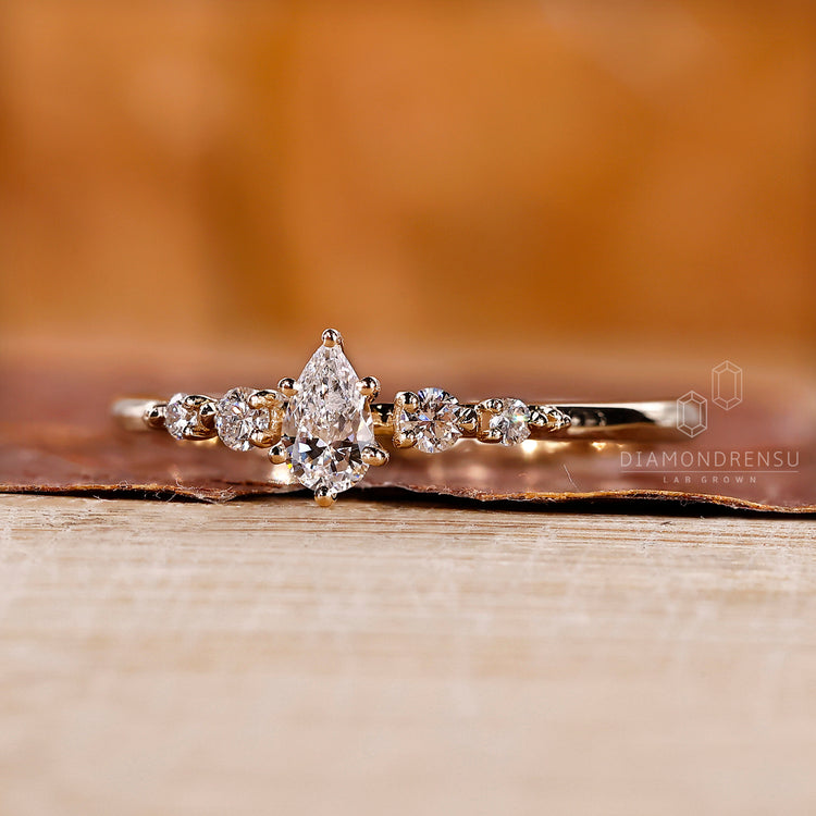 5 stone diamond ring with shared prong setting and custom handmade design.