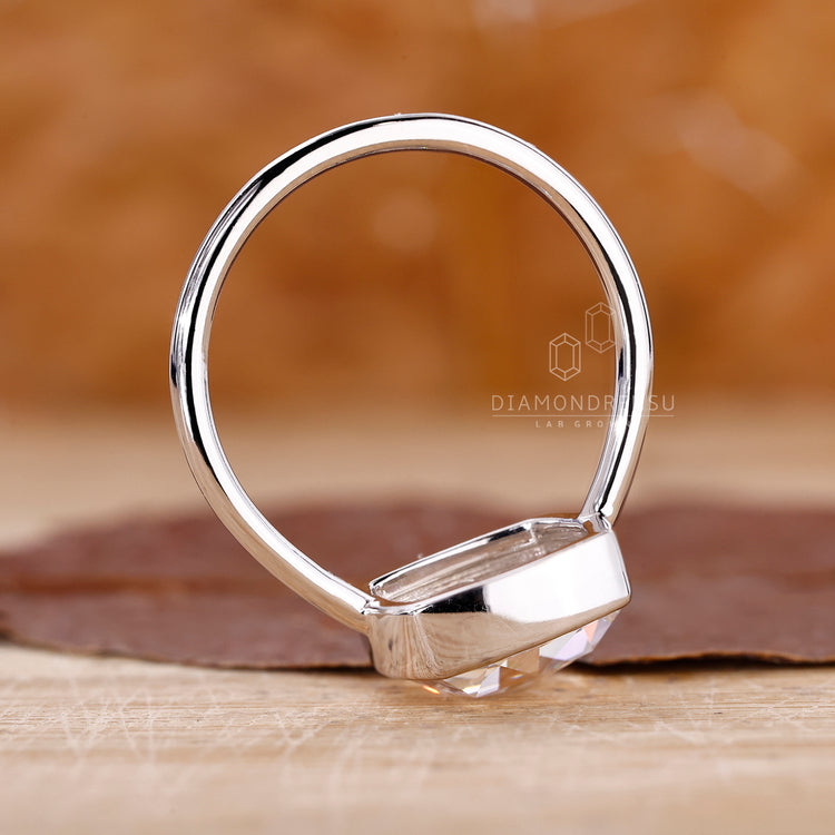 Lab grown diamond solitaire ring with white gold band.