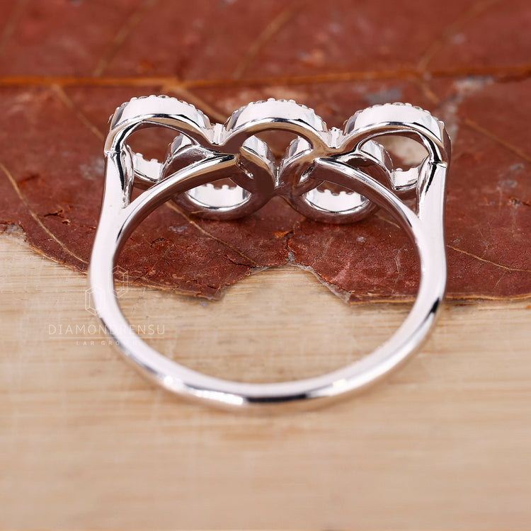 Handmade jewelry with round stones in a circle setting.