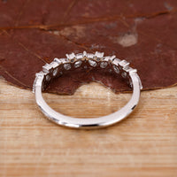 Buy wedding band with handcrafted diamond details.